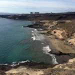 The rocky formation divides Playa Diego Hernandez - with the lower section having more nudists